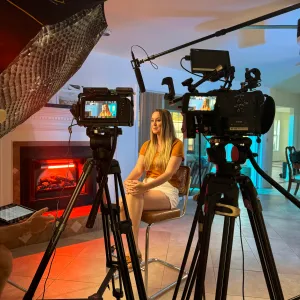 Two-camera interview setup for brand video production with cinematic lighting